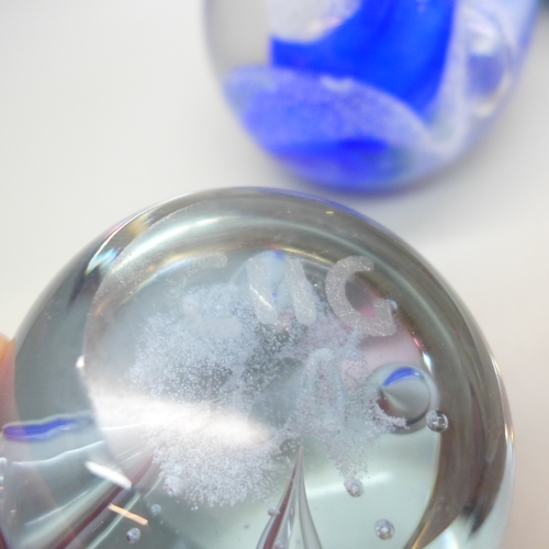 2022 - Four glass paperweights including two CIIG Caithness examples and other Caithness in blue with contr... 