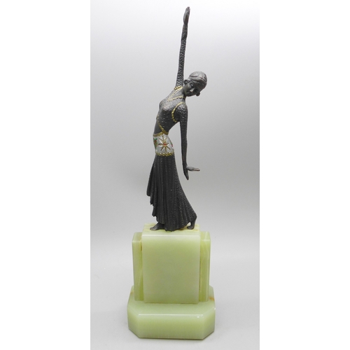 2028 - A small bronze Art Deco style figure on an onyx base, in the manner of Demetre Chiparus, (Romanian 1... 