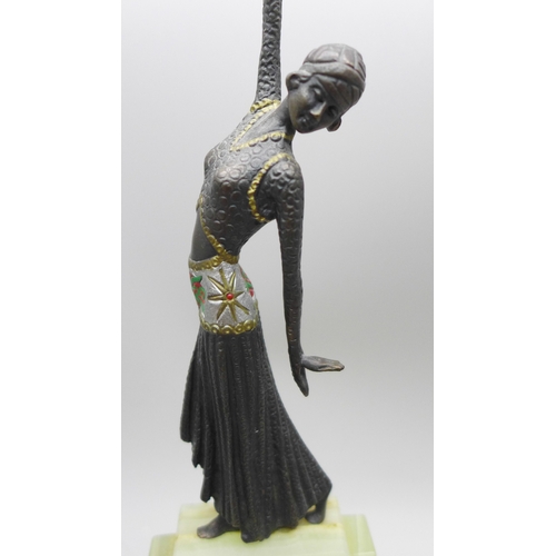 2028 - A small bronze Art Deco style figure on an onyx base, in the manner of Demetre Chiparus, (Romanian 1... 