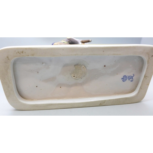 2032 - A Ludwigsburg continental porcelain figure of a gentleman seated on a goat, a/f, 19.5cm