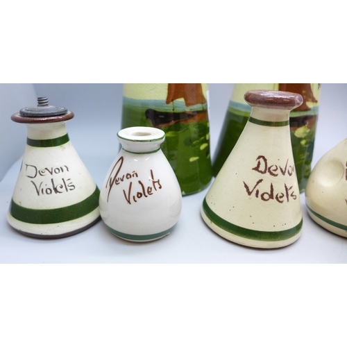 2038 - Four Devon Violets pottery scent bottles, one marked Cornish Violets, one marked Blackpool Breezes a... 
