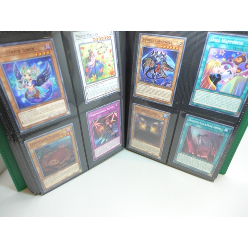 2040 - A folder of Yu-Gi-Oh cards including over 80 Holographic and 1st editions, 160 cards in total