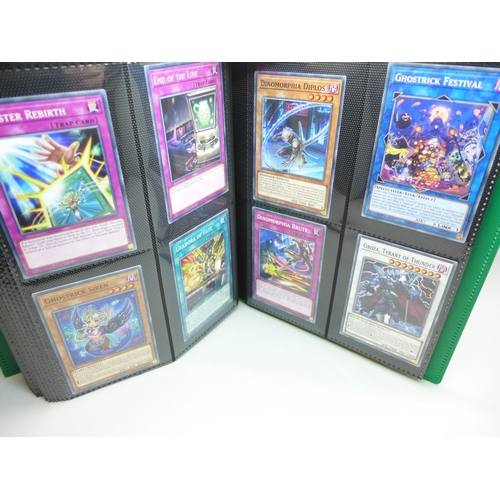 2040 - A folder of Yu-Gi-Oh cards including over 80 Holographic and 1st editions, 160 cards in total