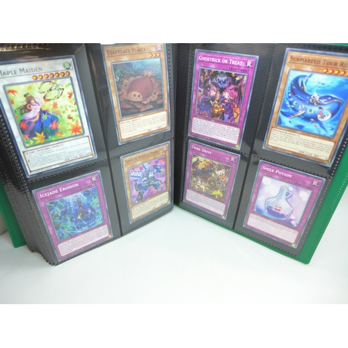 2040 - A folder of Yu-Gi-Oh cards including over 80 Holographic and 1st editions, 160 cards in total