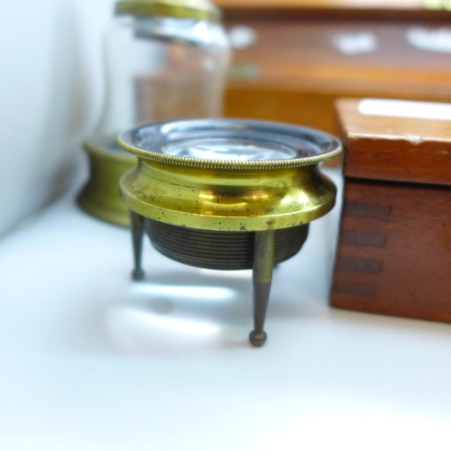 2044 - A Stanley rolling rule, boxed, two other boxes with wooden rulers, a cased set of balance scales wit... 