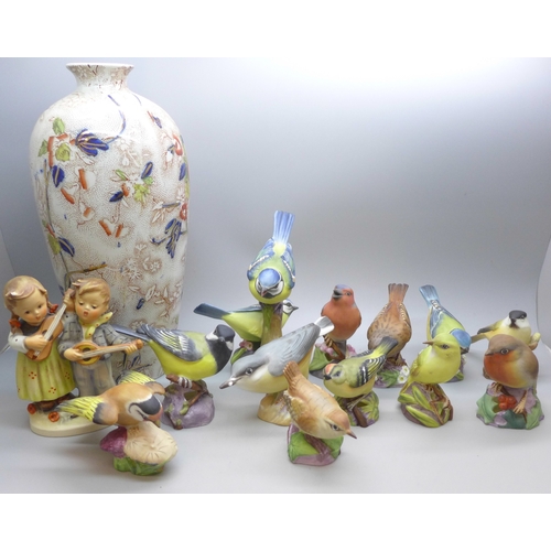 2045 - A collection of twelve Royal Worcester bird figures, a Hummel figure and a Corona Ware vase