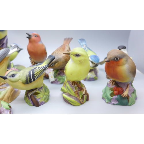 2045 - A collection of twelve Royal Worcester bird figures, a Hummel figure and a Corona Ware vase