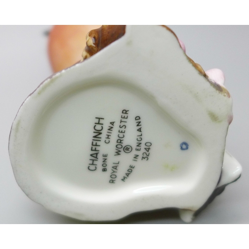 2045 - A collection of twelve Royal Worcester bird figures, a Hummel figure and a Corona Ware vase