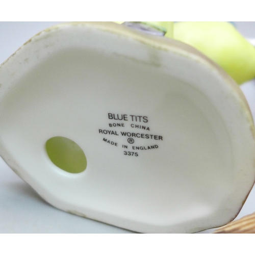 2045 - A collection of twelve Royal Worcester bird figures, a Hummel figure and a Corona Ware vase