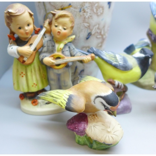 2045 - A collection of twelve Royal Worcester bird figures, a Hummel figure and a Corona Ware vase