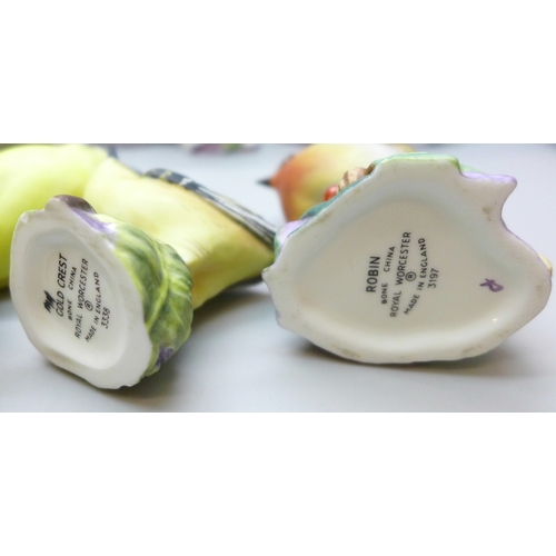 2045 - A collection of twelve Royal Worcester bird figures, a Hummel figure and a Corona Ware vase