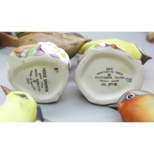 2045 - A collection of twelve Royal Worcester bird figures, a Hummel figure and a Corona Ware vase