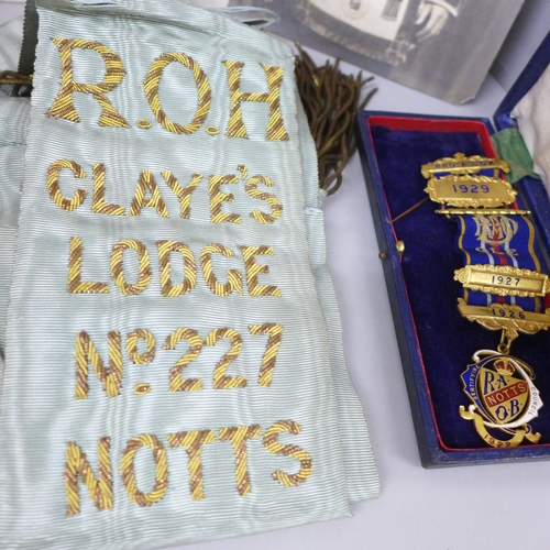 2058 - A collection of Royal Antediluvian Order of Buffaloes (RAOB) items to include sash, medals, arm cuff... 