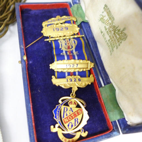 2058 - A collection of Royal Antediluvian Order of Buffaloes (RAOB) items to include sash, medals, arm cuff... 