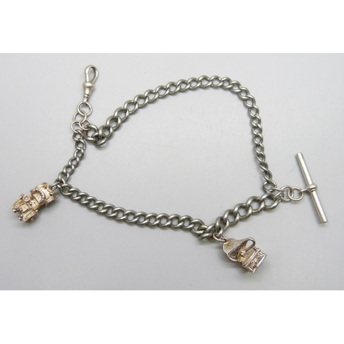 7177 - A silver plated double chain Albert bracelet, with two white metal charms, 20cm, dog clip and T bar ... 