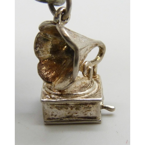 7177 - A silver plated double chain Albert bracelet, with two white metal charms, 20cm, dog clip and T bar ... 