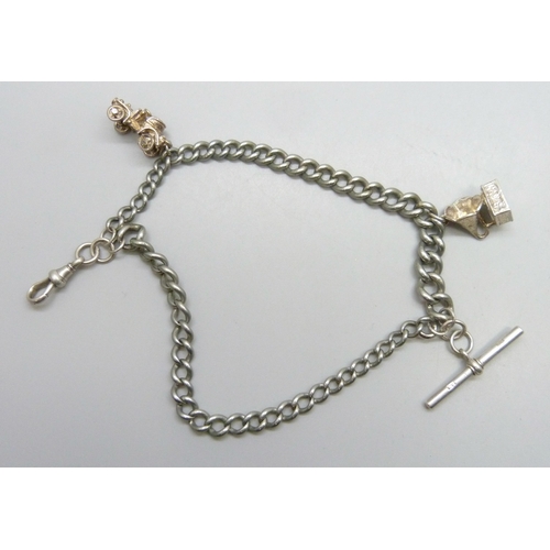 7177 - A silver plated double chain Albert bracelet, with two white metal charms, 20cm, dog clip and T bar ... 