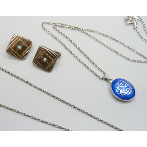 7180 - A collection of silver jewellery including an enamelled Celtic locket, .835 cufflinks, a white metal... 