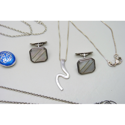 7180 - A collection of silver jewellery including an enamelled Celtic locket, .835 cufflinks, a white metal... 