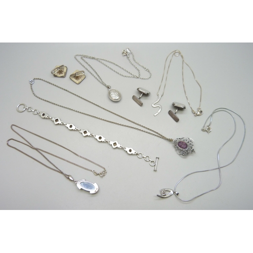 7180 - A collection of silver jewellery including an enamelled Celtic locket, .835 cufflinks, a white metal... 