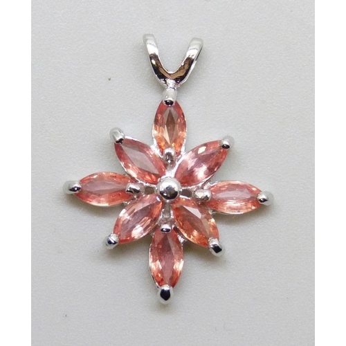 7189 - An 18ct white gold pendant set with peach colour stones, 2.7g, 2.3cm including bale