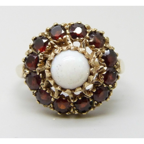 7196 - A 9ct gold, opal and garnet cluster ring, 4g, M