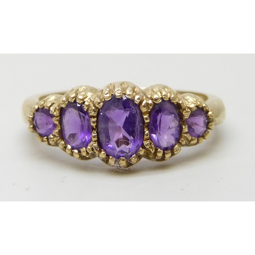 7198 - A 9ct gold five stone amethyst ring, 2.2g, N