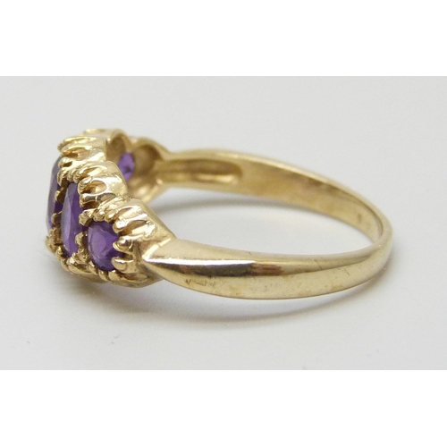 7198 - A 9ct gold five stone amethyst ring, 2.2g, N
