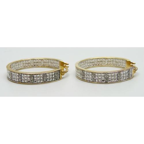 7199 - A pair of silver gilt diamond set hoop earrings, 2.6cm