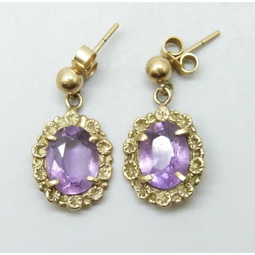 7203 - A pair of 9ct gold and amethyst drop earrings, unmatched butterflies, 3.3g total weight, 2.3cm