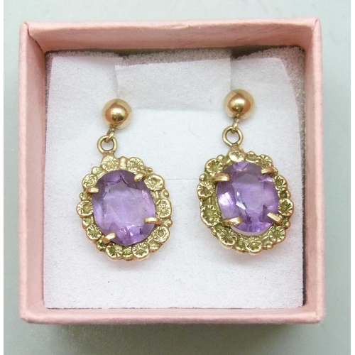 7203 - A pair of 9ct gold and amethyst drop earrings, unmatched butterflies, 3.3g total weight, 2.3cm