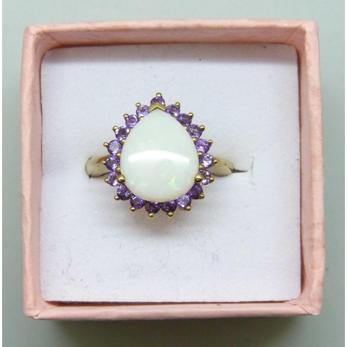7207 - A silver gilt opal and amethyst cluster ring, L/M