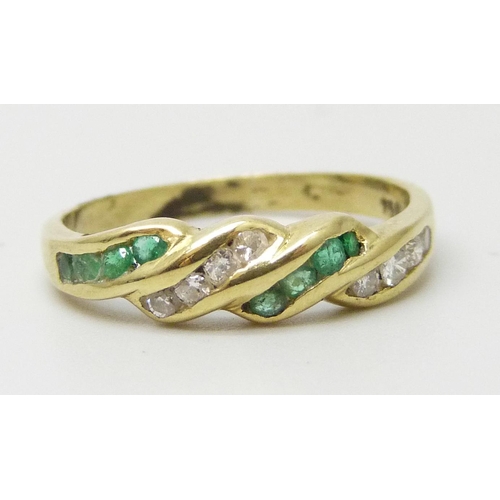 7209 - A yellow metal, emerald and diamond ring, marked 750, 2.5g, N