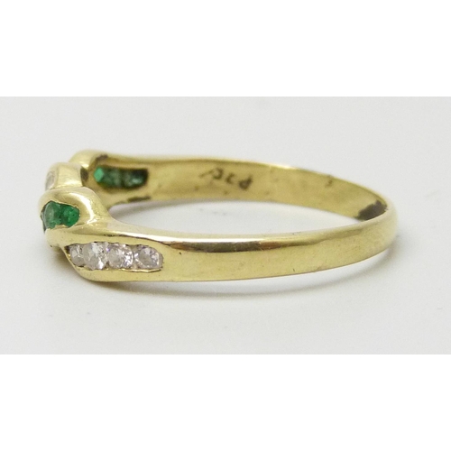 7209 - A yellow metal, emerald and diamond ring, marked 750, 2.5g, N
