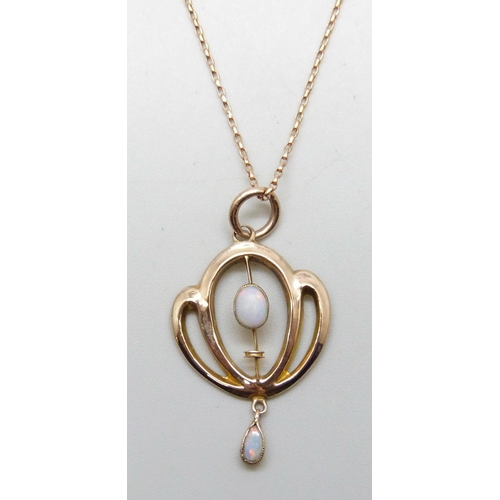 7211 - An Edwardian Art Nouveau 9ct rose gold and opal pendant, 3cm including bale, on a modern 9ct rose go... 