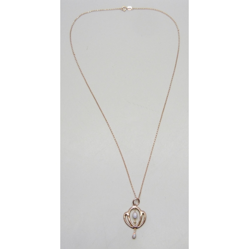 7211 - An Edwardian Art Nouveau 9ct rose gold and opal pendant, 3cm including bale, on a modern 9ct rose go... 