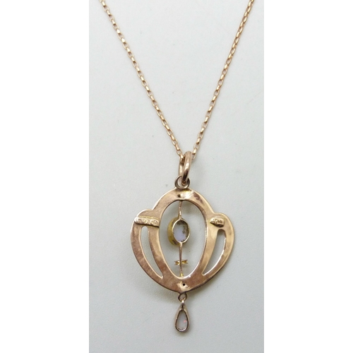 7211 - An Edwardian Art Nouveau 9ct rose gold and opal pendant, 3cm including bale, on a modern 9ct rose go... 