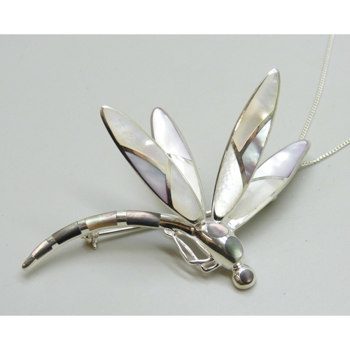 7213 - A large silver and mother of pearl dragonfly brooch or pendant, 8cm, on a silver chain