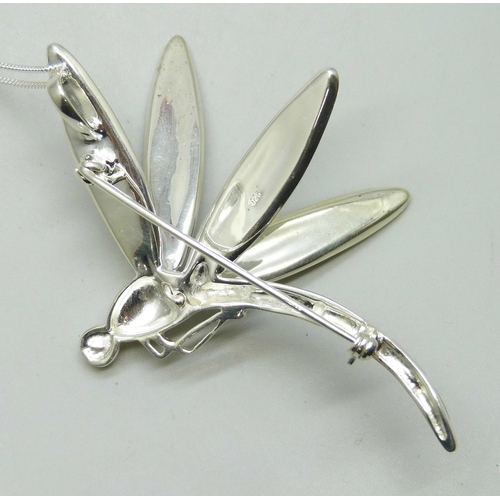 7213 - A large silver and mother of pearl dragonfly brooch or pendant, 8cm, on a silver chain