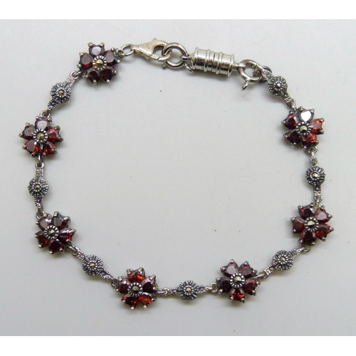 7217 - A silver, garnet and marcasite bracelet with added plated magnetic clasp, 19.5cm