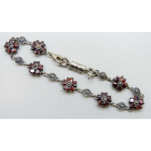 7217 - A silver, garnet and marcasite bracelet with added plated magnetic clasp, 19.5cm