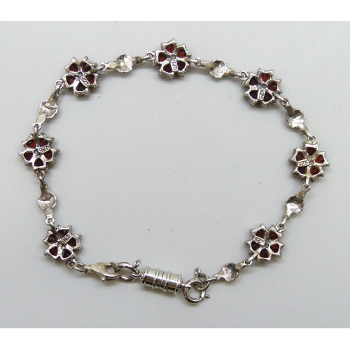 7217 - A silver, garnet and marcasite bracelet with added plated magnetic clasp, 19.5cm