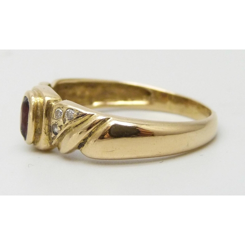 7218 - A yellow metal, garnet and white stone ring with control marks to outer shank, 3.1g, Q