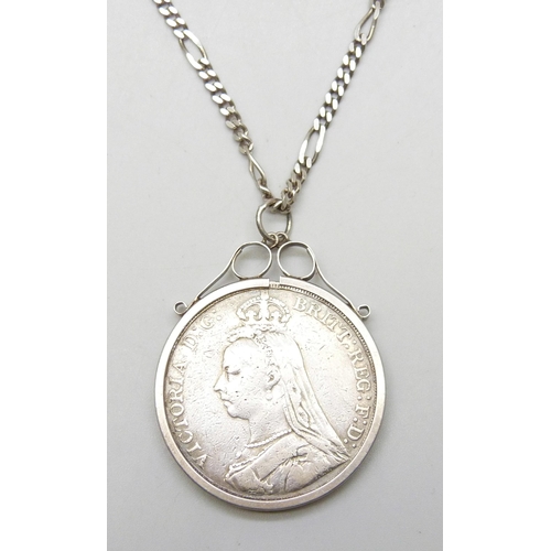 7219 - An 1889 Victorian crown in a white metal mount, on a silver figaro chain, 43g total weight