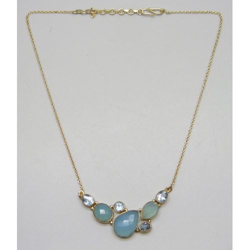 7220 - A silver gilt multi-gem necklace including topaz, 46cm