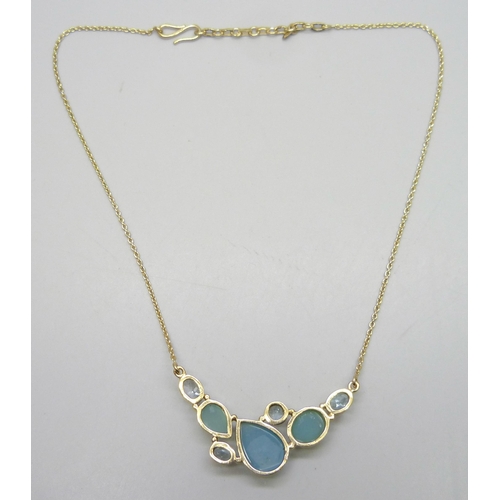 7220 - A silver gilt multi-gem necklace including topaz, 46cm