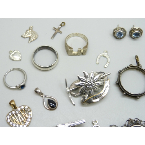 7221 - A collection of assorted earrings and charms, etc. some marked as silver