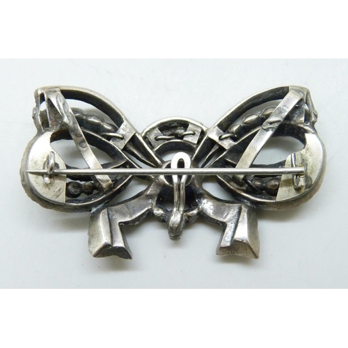 7223 - A circa 1920s/30s Art Deco white metal set paste brooch, alteration verso, 6.1cm, 27g
