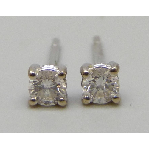 7236 - A pair of 18ct white gold diamond ear studs, 0.8g