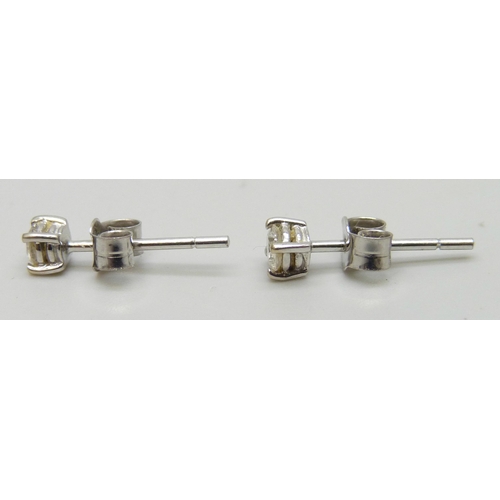 7236 - A pair of 18ct white gold diamond ear studs, 0.8g